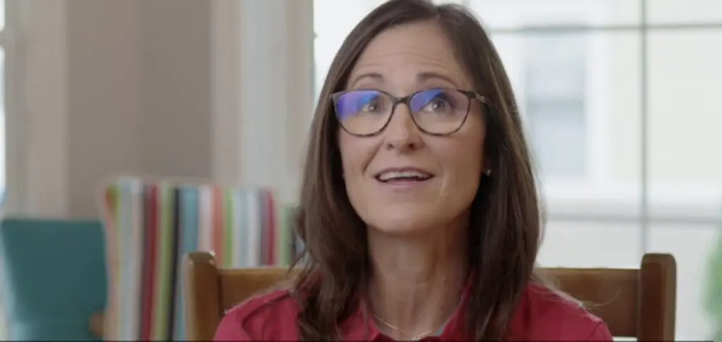 youtube thumbnail of woman wearing glasses and smiling