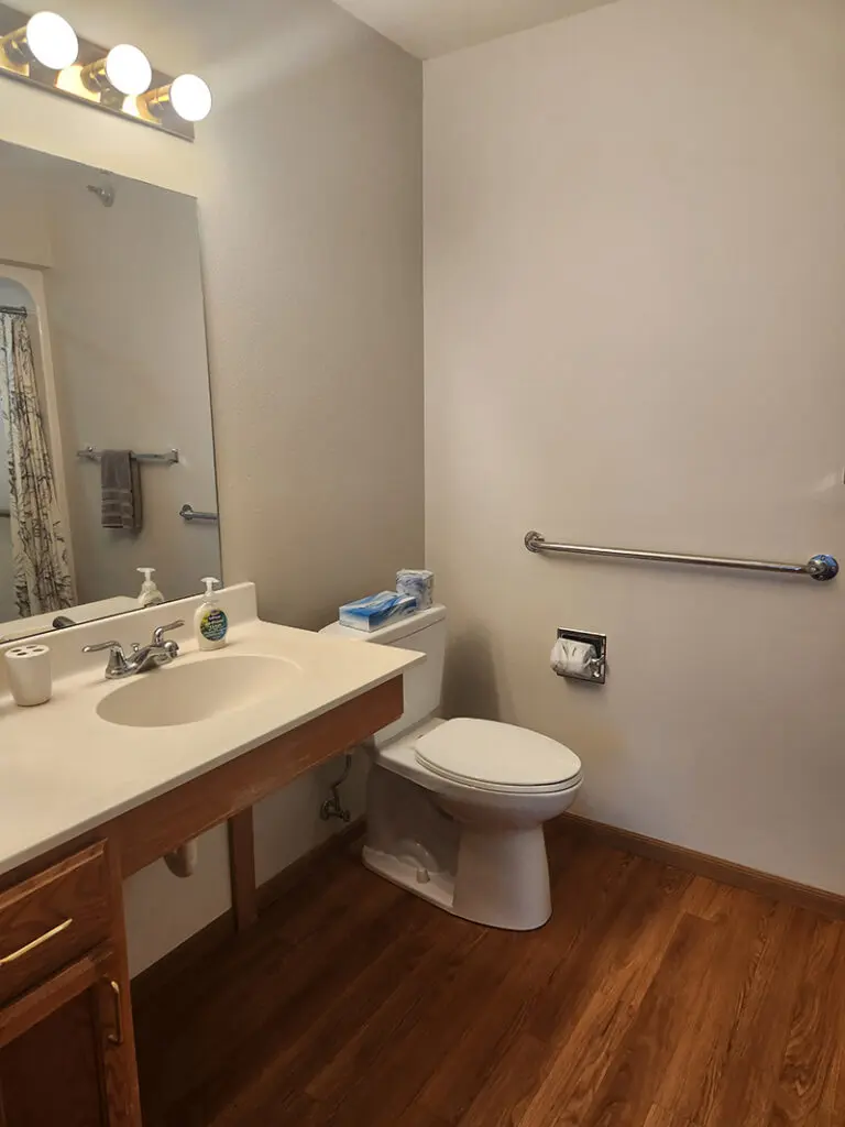 bathroom with view of sink in community residence